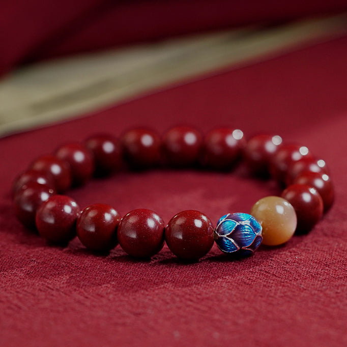 Handmade Cinnabar Bracelet with Lotus and Sunstone - Enamel Lotus Charm for Serenity and Good Fortune